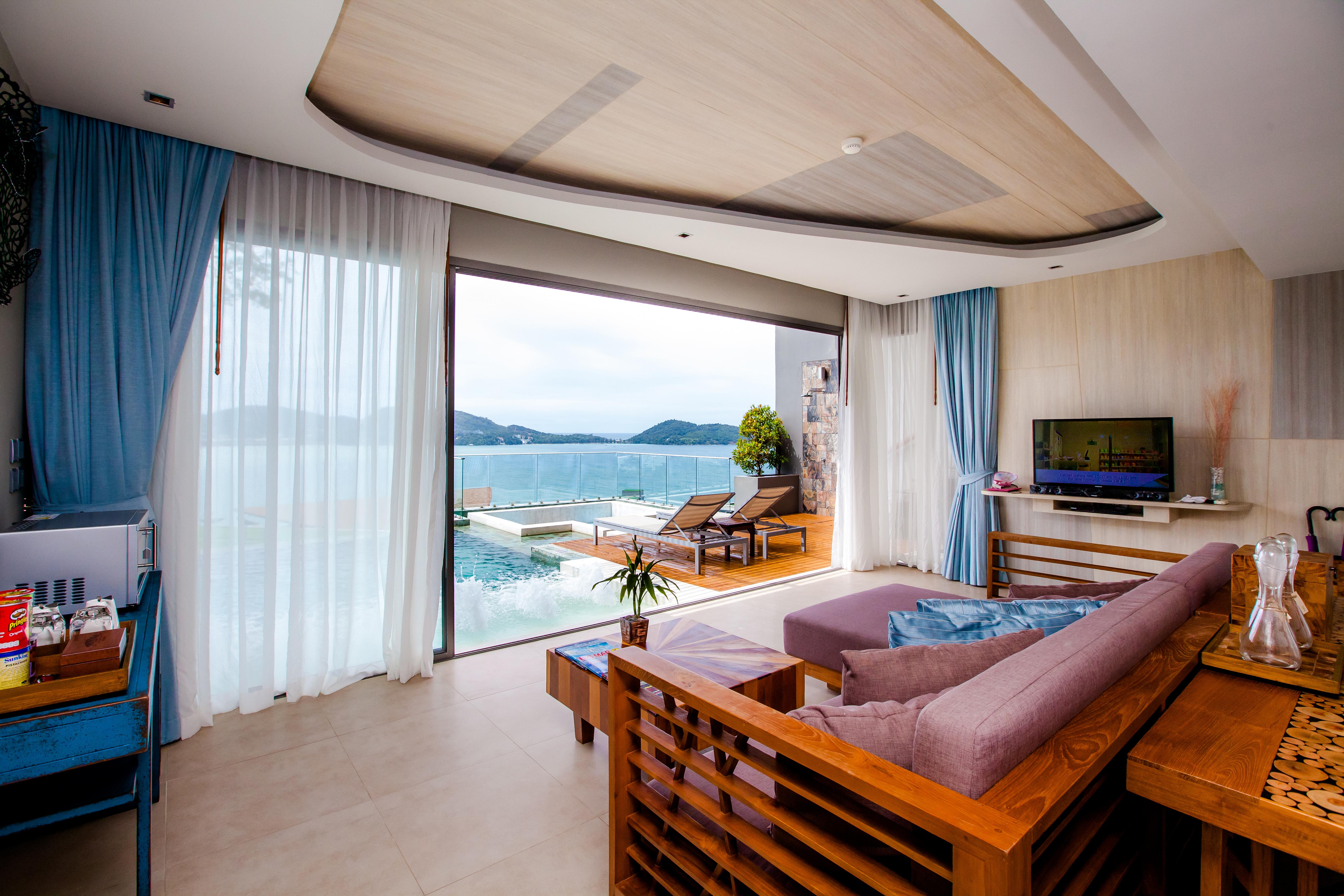 Kalima Resort And Spa Patong Kültér fotó A living room in a hotel