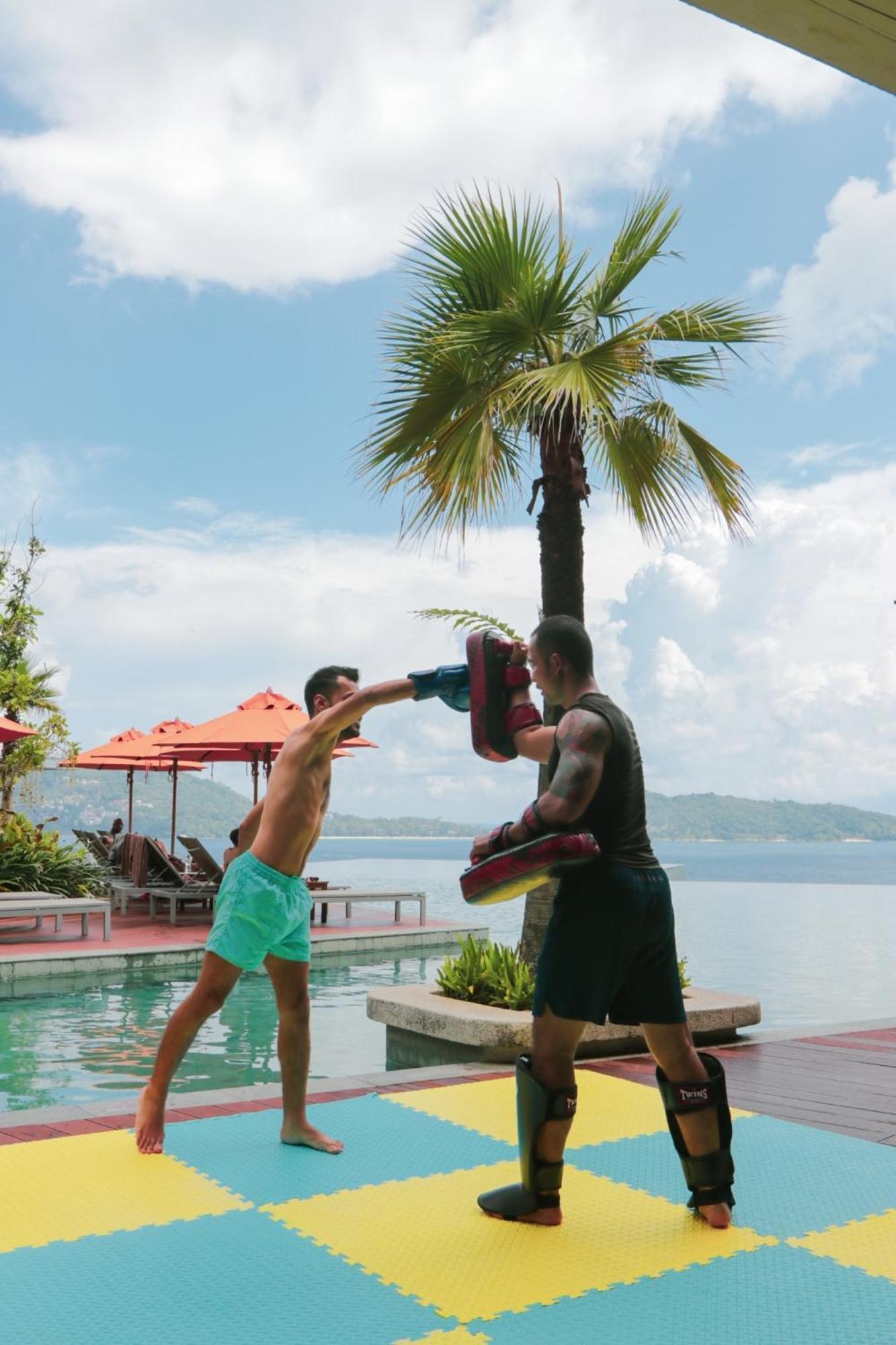 Kalima Resort And Spa Patong Kültér fotó Training with a heavy bag